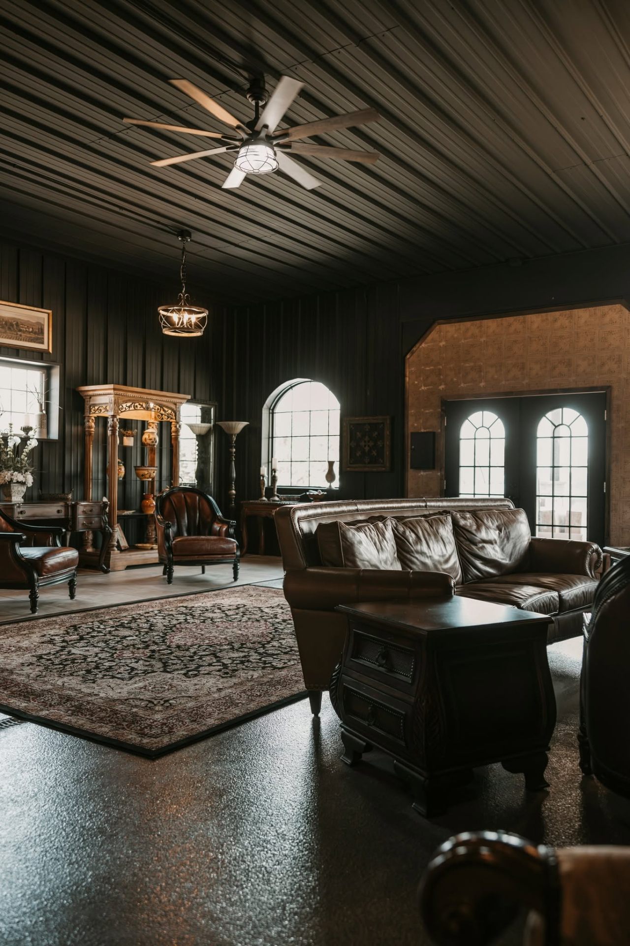 Leather lounge seating with arched windows